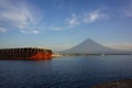 Huge tanker ship anchored in Legazpi City Port and a view of Mayon Volcano in Philippines