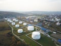 Huge tanks with fuel and flammable substances on the territory of the refinery. View from the drone at a height of bird flight. Th