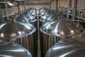 Huge Tanks of white metal, which brewed beer in the brewery, the top view