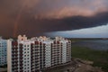 A huge thundercloud covered the house. The sky with rainbow Royalty Free Stock Photo