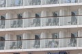 A huge tourist liner - cabin balconies and folding chairs