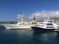 A huge tourist ship in the port on a bright sunny day. Cruise ship docked in port. Concept: tourism and travel Royalty Free Stock Photo