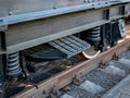 Huge train springs and leaf spring over the wheels. Train wheel system, detail Royalty Free Stock Photo