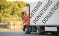 huge truck move with donation supplies inside, help to the poor coutries on the earth Royalty Free Stock Photo