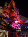 The huge unburned joss stick light up the night scene outside the house.