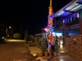 The huge unburned joss stick light up the night scene outside the house.