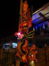 The huge unburned joss stick light up the night scene outside the house.