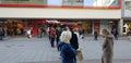 Huge waiting lines at stores in times of Corona Covid-19 pandemic - SAARBRUECKEN, GERMANY - DECEMBER 05, 2020