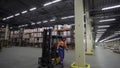 A huge warehouse.Creative.A large storage of orders, which are carried by special boxes and moved by people in special