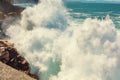 A huge wave is breaking on the rocks Royalty Free Stock Photo