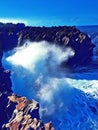 Huge wave breaks on rock. Digital illustration of huge ocean power.