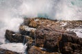 Huge wave crashing rocky coastline in Hermanus, South Africa Royalty Free Stock Photo