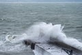 Huge waves engulfing the lighthouse at Mevagissey, Cornwall