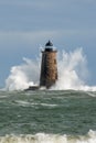 Huge Waves Surround Stone Lighthouse Tower in Maine Royalty Free Stock Photo