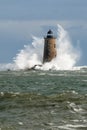 Huge Waves Surround Stone Lighthouse Tower in Maine Royalty Free Stock Photo