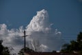 Huge White Billowing Cumulonimbus cloud in blue sky. Australia. Atmospheric sky art image