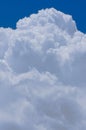 Huge white cotton clouds over a blue sky