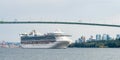 Huge white ocean cruise liner passing famous Lion Gates Bridge Royalty Free Stock Photo