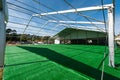 Huge white tent with green floor in field