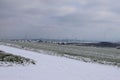 snow covered dirt road in the Eifel with wind power plants