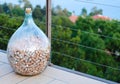 Huge wine bottle full of wine corks at the winery terrace with a sea view. Wine corks in a very big wine bottle for storing wine Royalty Free Stock Photo