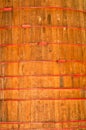 Huge wood wine container, with red metal bands to keep secure