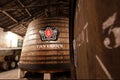 Huge wooden barrel inside the old winery Tailor`s, it making porto wine from 1692 in traditional winemaking