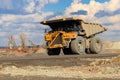 Huge yellow mining dump truck working in iron ore quarry. Mining industry Royalty Free Stock Photo