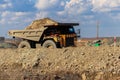 Huge yellow mining dump truck working in iron ore quarry. Mining industry Royalty Free Stock Photo