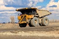 Huge yellow mining dump truck working in iron ore quarry. Mining industry Royalty Free Stock Photo