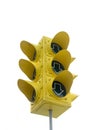 A huge yellow traffic light isolated against a light background Royalty Free Stock Photo