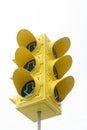 A huge yellow traffic light isolated against a light background Royalty Free Stock Photo