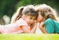Hugging and kissing kids couple. Little lovely children outdoor. Children in summer park, close up face. Kids love