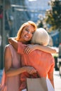 Hugging mother after going shopping stock photo Royalty Free Stock Photo