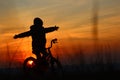 Hugging the sunset on the bike Royalty Free Stock Photo
