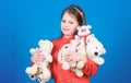 Hugging teddy bear. little girl playing game in playroom. toys for kid. small girl with soft bear toy. happy childhood Royalty Free Stock Photo