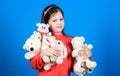 Hugging teddy bear. little girl playing game in playroom. toys for kid. small girl with soft bear toy. happy childhood Royalty Free Stock Photo