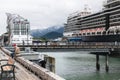 hugh cruise liners with thousands of holiday makers in the harbour of Juneau