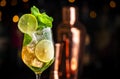 Hugo spritz alcoholic cocktail drink with dry sparkling wine or prosecco, elderflower syrup, soda, lime, mint and ice, dark bar Royalty Free Stock Photo