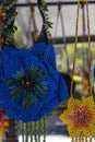 huichol wixarika culture selling their handicrafts in a public square, handicrafts made