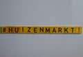 Huizenmarkt dutch word on wooden blocks with black letters