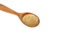Hulbah powder or Fenugreek flour in wooden spoon isolated on white background, close-up, selective focus. Herbal nutritional Royalty Free Stock Photo