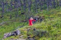 Huldra dances in front of the Kjosfossen waterfall in Norway