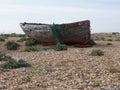 The hull of an abandoned fishing boat on Dungeness beach Royalty Free Stock Photo