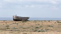 The hull of an abandoned fishing boat on Dungeness beach Royalty Free Stock Photo