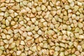 Hulled common buckwheat grains macro photo from above