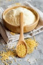 Hulled millet flour and grain in a bowl Royalty Free Stock Photo