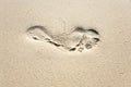 Human adult footprint in the fine sand