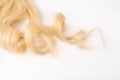 Human blond wavy hair on isolated background