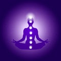 Human body in yoga lotus asana and seven chakras symbols on dark blue purple starry background Royalty Free Stock Photo